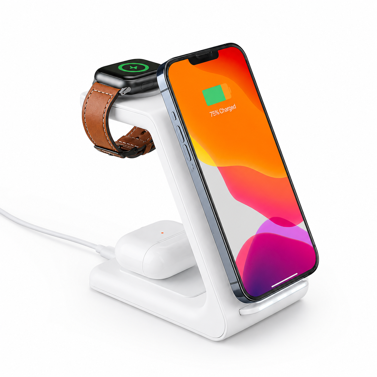 PrimeSync premium 3-in-1 wireless charging stand shown in matte white. The stand is simultaneously charging an iPhone vertically, a silver Apple Watch with a leather band on the top puck, and white wireless earbuds resting in the base cradle.