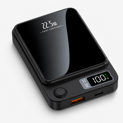 PrimeSync MagBoost 10000mAh magnetic power bank shown in a sleek matte dark grey finish. Isometric view showcases the glossy black front faceplate, the circular power button, and the bright green LED digital battery percentage display.